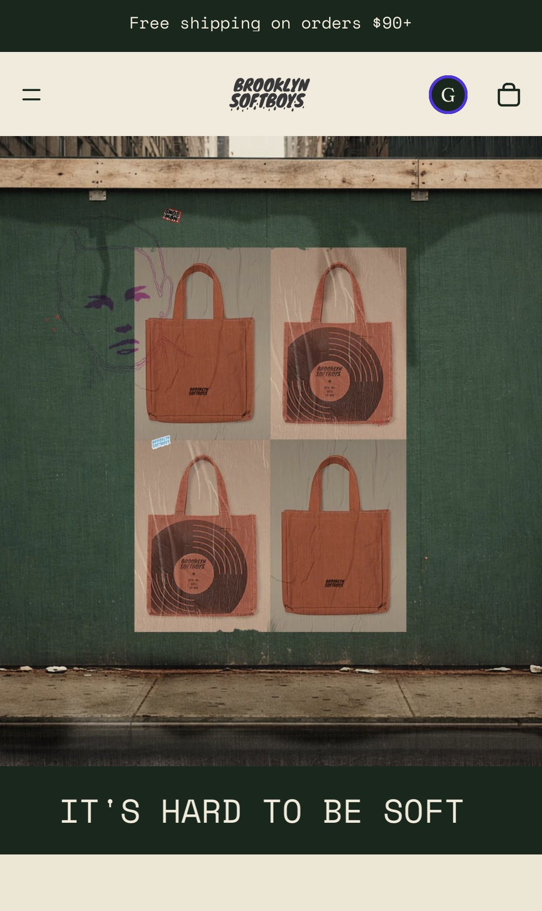 Brooklyn SoftBoys Shopify storefront homepage on mobile — wheatpasted tote-bag posters on a green wall above the line It's hard to be soft.