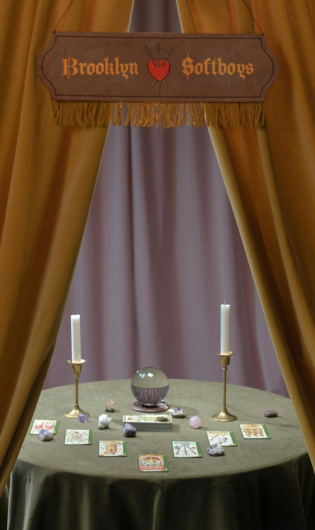 Teaser graphic: a tarot reading table framed by theatre curtains under a Brooklyn SoftBoys sign.