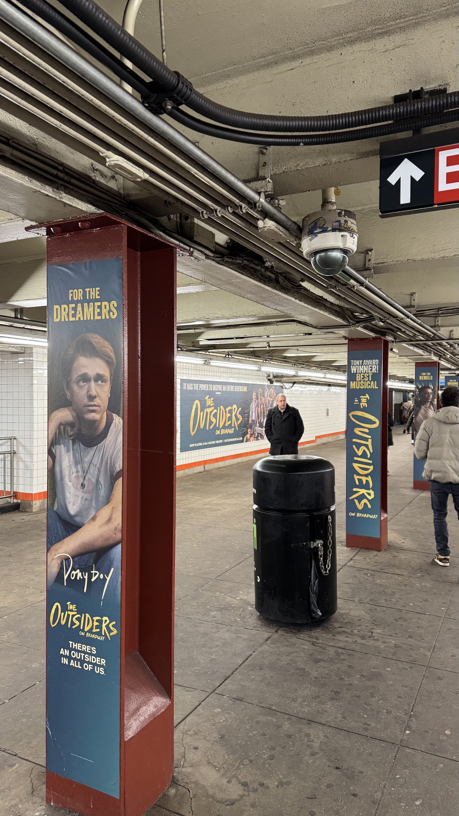 Pillar wrap for Ponyboy — For the Dreamers — with more wraps and a wall banner receding down the platform.
